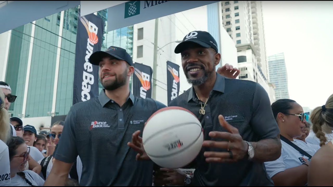 Two men with a cap and holding a basketball for Bounce Back from Cancer event